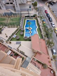 Swimmingpoolen hos eller tæt på Apartamento Olimpo Elite 8A