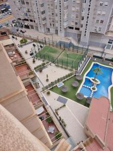 Swimmingpoolen hos eller tæt på Apartamento Olimpo Elite 8A