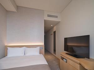 Roynet Hotel Seoul Mapoにあるベッド