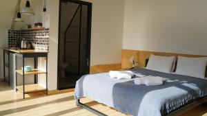 A bed or beds in a room at Kazbegi View