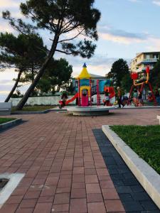 a playground in a park with a play structure at Mariami's sweet home in Kobuleti