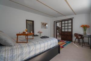 A bed or beds in a room at Spectacular Cave with two large terraces (70m2) by the sea
