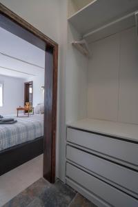A bed or beds in a room at Spectacular Cave with two large terraces (70m2) by the sea