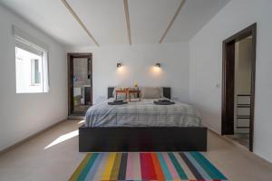 A bed or beds in a room at Spectacular Cave with two large terraces (70m2) by the sea