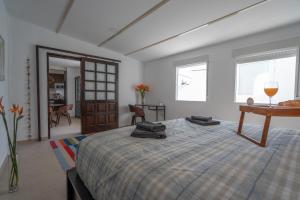 A bed or beds in a room at Spectacular Cave with two large terraces (70m2) by the sea