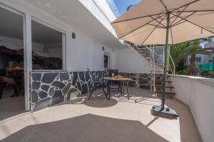 A patio or other outdoor area at Spectacular Cave with two large terraces (70m2) by the sea