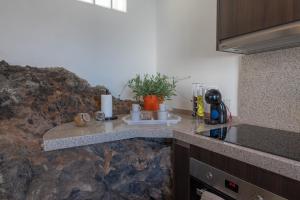A kitchen or kitchenette at Spectacular Cave with two large terraces (70m2) by the sea