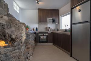 A kitchen or kitchenette at Spectacular Cave with two large terraces (70m2) by the sea