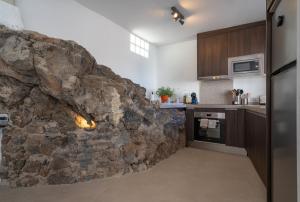 A kitchen or kitchenette at Spectacular Cave with two large terraces (70m2) by the sea