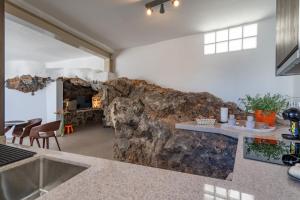 A kitchen or kitchenette at Spectacular Cave with two large terraces (70m2) by the sea