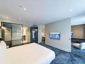Ліжко або ліжка в номері Pullman Adelaide