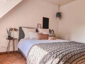 מיטה או מיטות בחדר ב-Weynhoven