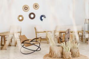 a room with wooden chairs and tables and chairs at Costa Maya Bodrum in Bodrum City