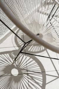 a shadow of a white umbrella on the floor at Costa Maya Bodrum in Bodrum City