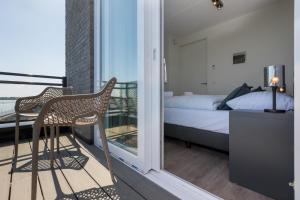 Katil atau katil-katil dalam bilik di Vakantiewoning aan het water - met 2 balkons - Vista Maris - Nr 16 +28 gambar