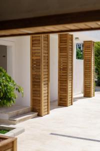 a set of wooden shutters on the side of a building at Costa Maya Bodrum in Bodrum City