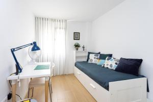 Postel nebo postele na pokoji v ubytování Home2Book Elegance City Center Apartment