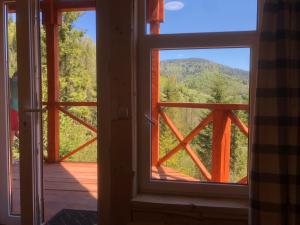 an open door with a view of a mountain view at Аляска in Oryavchyk