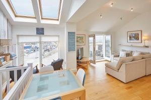 a living room with a couch and a table at Host & Stay - The Plaice in Seahouses