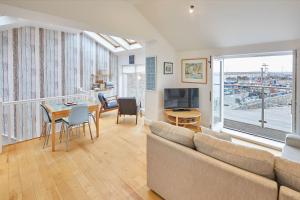a living room with a couch and a table at Host & Stay - The Plaice in Seahouses