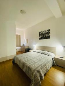 a bedroom with a large bed in a room at Green Gallery Hotel and Restaurant in Muravera