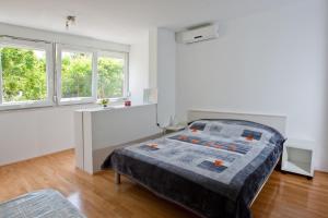 Giường trong phòng chung tại Apartment Busic in Split