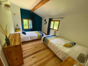 Posteľ alebo postele v izbe v ubytovaní Gîte le Moulin Samsara