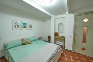 Кровать или кровати в номере A casa di Emma