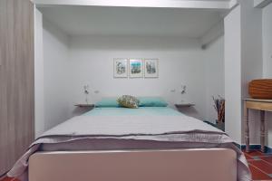 Кровать или кровати в номере A casa di Emma