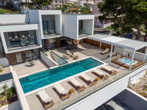 an aerial view of a villa with a swimming pool at New! Villa Bava with 4 En-suite Bedrooms, Heated 33 sqm Pool in Omiš +42 photos