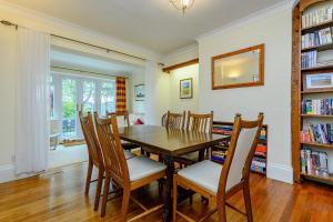 a dining room with a table and chairs at Caradoc in Chepstow