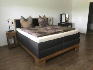 a large bed in a room with at Apartment Sioux in Eging