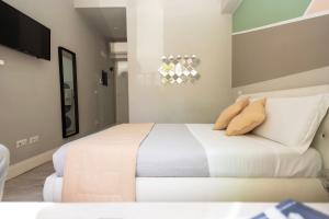 A bed or beds in a room at Scipioni Best Rooms