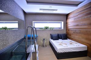 Posteľ alebo postele v izbe v ubytovaní HOTEL PECR WELL