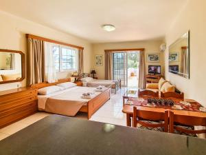 Posteľ alebo postele v izbe v ubytovaní Colonial Studio/Apartment