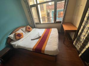 Postel nebo postele na pokoji v ubytování Holy Land Hotel Nepal