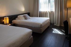 Krevet ili kreveti u jedinici u objektu G Hotel Ancona