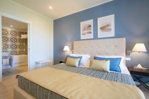 Llit o llits en una habitació de Hotel Rivage Taormina