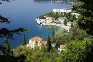 a town on a hill with a large body of water at Bed&Breakfast Villa Eva in Omišalj
