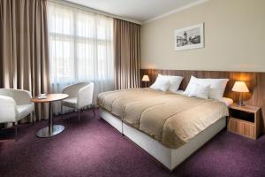 Rúm í herbergi á Clarion Hotel Prague Old Town