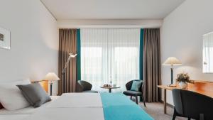 Rúm í herbergi á Dorint Hotel Dresden