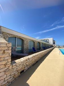 The swimming pool at or close to Baia dei Mulini Resort & Spa