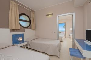 Postel nebo postele na pokoji v ubytování Hotel Mareluna