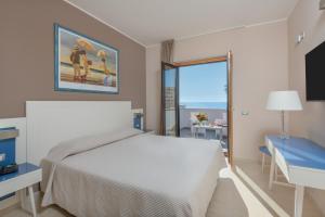 Postel nebo postele na pokoji v ubytování Hotel Mareluna