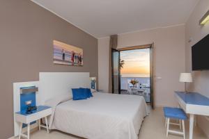 Postel nebo postele na pokoji v ubytování Hotel Mareluna