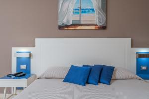 Postel nebo postele na pokoji v ubytování Hotel Mareluna