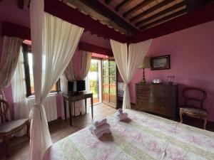 Postel nebo postele na pokoji v ubytování Agriturismo Le Sughere + 20 fotografií
