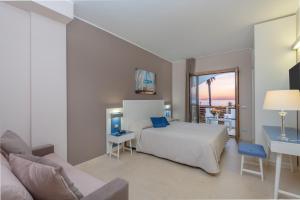 Postel nebo postele na pokoji v ubytování Hotel Mareluna