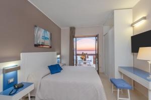 Postel nebo postele na pokoji v ubytování Hotel Mareluna