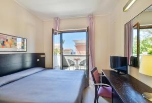 Postel nebo postele na pokoji v ubytování Hotel Mareluna